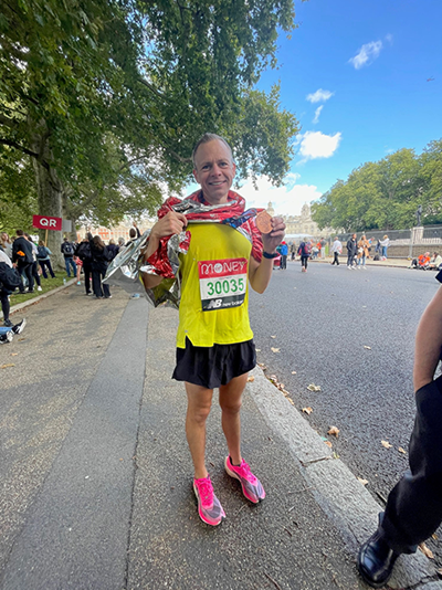 Kai at a marathon showing his number